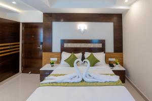 Postel nebo postele na pokoji v ubytování Hotel Kheni