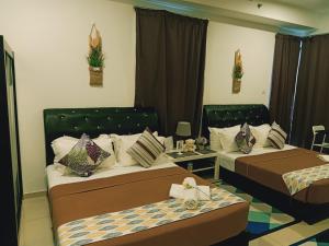 Studio I-Soho D'Gunduls Homestay by DGH I-CITY客房内的一张或多张床位