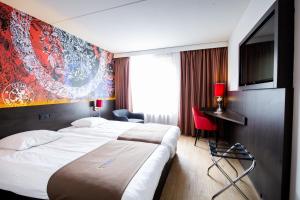 Postel nebo postele na pokoji v ubytování Bastion Hotel Maastricht Centrum
