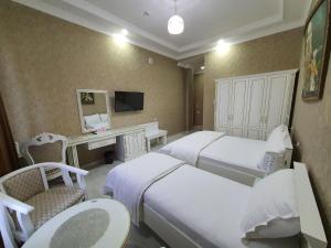 Postel nebo postele na pokoji v ubytování Ideal Hotel