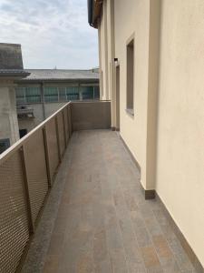 a balcony of a building with a walkway at Jacky House 3.0 in Lodi