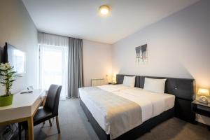 Postel nebo postele na pokoji v ubytování BLEECKER Hotels