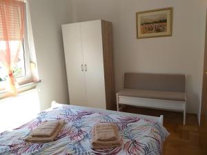 Posteľ alebo postele v izbe v ubytovaní Apartman Jelacic Vinkovci