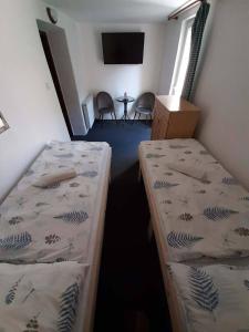 Postel nebo postele na pokoji v ubytování Apartmány Maksičky