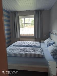 Ein Bett oder Betten in einem Zimmer der Unterkunft Der Amboss