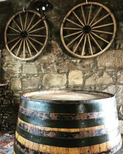 two old wine barrels on a stone wall at The Aberdeen Arms Hotel in Tarves