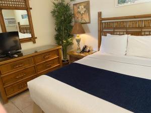 Postel nebo postele na pokoji v ubytování Casitas Coral Ridge