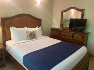 Postel nebo postele na pokoji v ubytování Casitas Coral Ridge