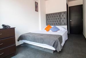 Postel nebo postele na pokoji v ubytování Hotel Grand H&R