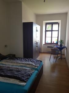 Posteľ alebo postele v izbe v ubytovaní Apartmany 123
