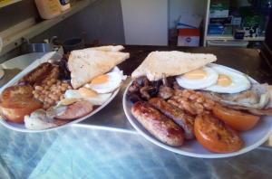 two plates of food on a counter with eggs and beans at Rum Bridge Gypsy 'Rose' in Sudbury