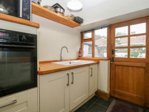 a kitchen with a sink and a stove at 2 Lime Street in Bridgwater