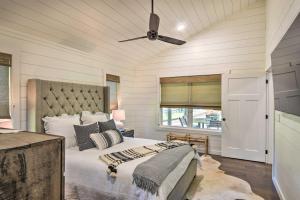a bedroom with a bed and a ceiling fan at Blue Ridge Cottage Modern Solace in the Mountains in Blue Ridge