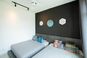 Säng eller sängar i ett rum på Migliore Homestay