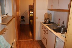 a small kitchen with a sink and a counter at Stafafell Cottages in Stafafell