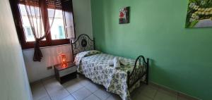 Ένα ή περισσότερα κρεβάτια σε δωμάτιο στο Costa Gaia Rooms