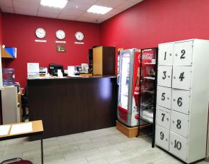 a store with a cash counter and two refrigerators at Penates Hostel in Yekaterinburg