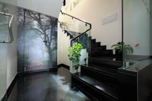 a hallway with stairs and a mural of trees at Sintra Boutique Hotel in Sintra