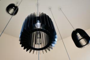 a ceiling fan with three lights hanging from it at Sintra Boutique Hotel in Sintra