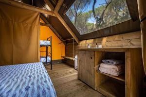 Postel nebo postele na pokoji v ubytování Camping Internazionale Etruria