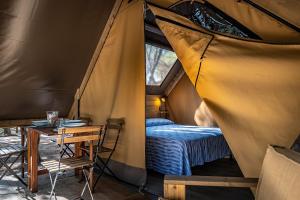 Postel nebo postele na pokoji v ubytování Camping Internazionale Etruria