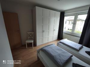 Postel nebo postele na pokoji v ubytování Wohnen im Herzen von Kleve