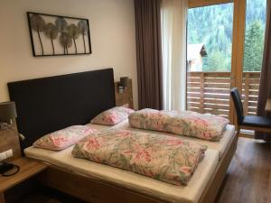 Postel nebo postele na pokoji v ubytování Landhaus Paradies Samnaun Spiss