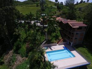 an aerial view of a building with a swimming pool at HOTEL EL POTRILLO in El Peñol +31 photos
