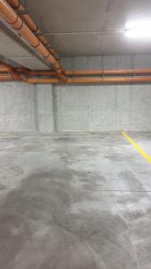 an empty parking garage with a pipe at Apartament Skarbowa 1& Parking in Leszno
