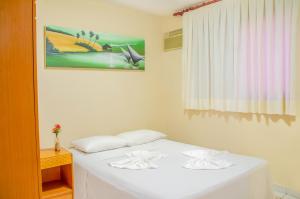 Katil atau katil-katil dalam bilik di Pousada Vale do Sul