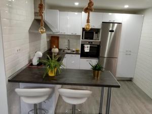 Kuchyň nebo kuchyňský kout v ubytování Apartamento céntrico recién reformado