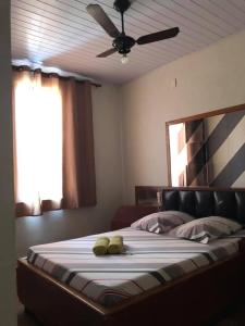 a bedroom with a bed with two teddy bears on it at Hotel Popular Vila Mariana in Sao Paulo +7 photos