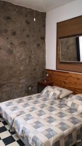 Ένα ή περισσότερα κρεβάτια σε δωμάτιο στο Casa rústica San Francisco 1