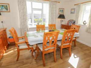 a dining room with a table and chairs at Bangor Cottage in Bangor