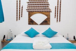 Postel nebo postele na pokoji v ubytování Casa Universo Holbox
