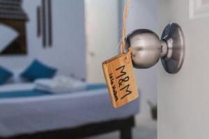 Postel nebo postele na pokoji v ubytování Casa Universo Holbox