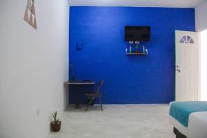 TV a/nebo společenská místnost v ubytování Casa Universo Holbox