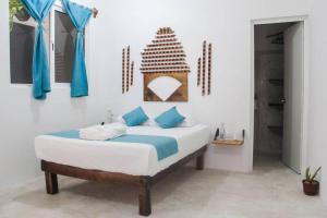 Postel nebo postele na pokoji v ubytování Casa Universo Holbox