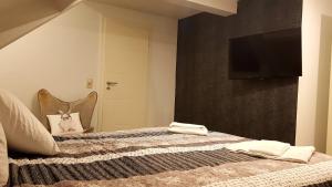 Postel nebo postele na pokoji v ubytování Les étangs du Thioux GUEST HOUSE