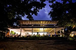 a house lit up at night at Barrier Beach Resort in Luganville