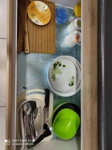 a drawer in a sink with dirty dishes in it at EVO Soho Suites, Bangi in Kampong Sungai Ramal Dalam