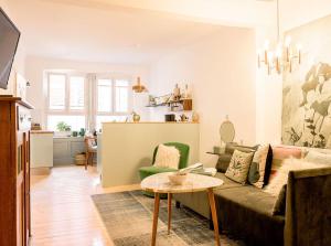 a living room with a couch and a table at altstadtherz in Lindau