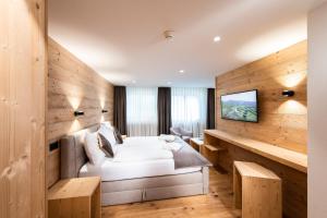 Postel nebo postele na pokoji v ubytování Posthotel Valbella