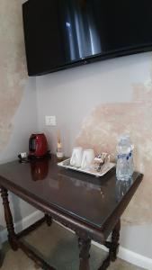 a table with a plate of food on top of it at B&B Suite 44 in Pesaro