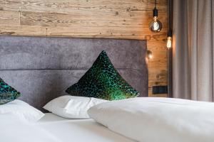 Postel nebo postele na pokoji v ubytování myLoisl Apartments