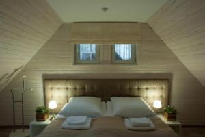 Кровать или кровати в номере Парк Отель Золотая Долина