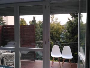 Balkón alebo terasa v ubytovaní Pokoje hotelowe Nad Zalewem