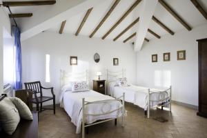 Postel nebo postele na pokoji v ubytování Agriturismo L'Incrociata