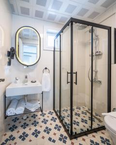 a bathroom with a shower and a sink at KIANA KALEİÇİ in Antalya