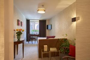 TV a/nebo společenská místnost v ubytování Boutiquehotel Oberkirch im Zentrum